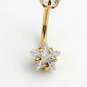 Piercing ombligo de acero quirúrgico 316L dorado con diseño de doble estrella y zirconias 5A transparentes de alto brillo.